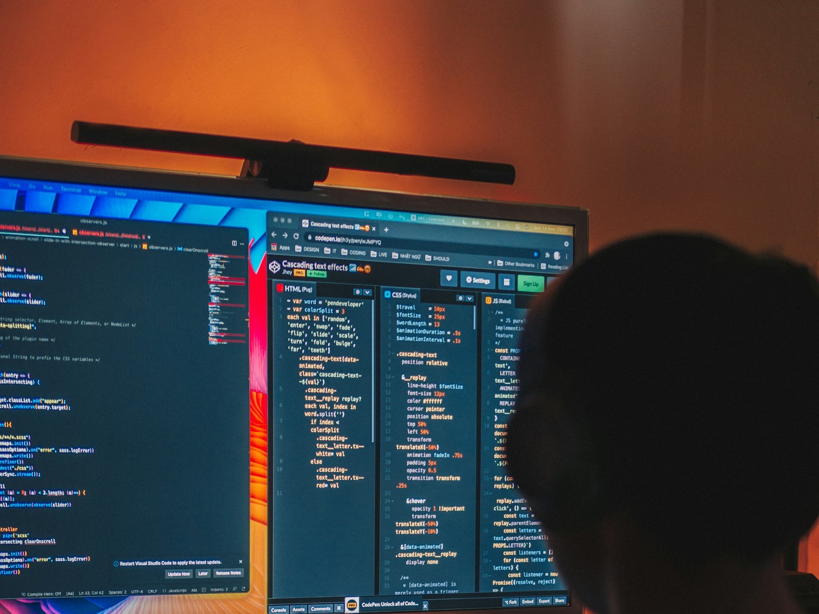 Engineer working with dual monitors